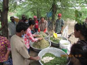 TPO provides support with livelihood initiative. Here is training in raising chickens and preparing food for them. 